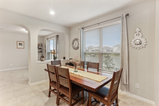 dining area featuring light tile patterned flooring