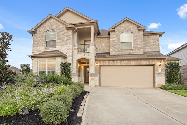 3522 Lake Lugano Cir, Katy, TX 77493 - view of front of house featuring a garage, driveway, brick siding, and stone siding