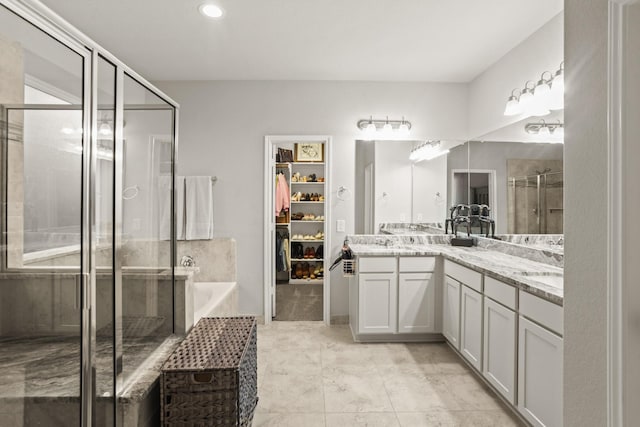 3522 Lake Lugano Cir, Katy, TX 77493 - full bath featuring a shower stall, double vanity, a spacious closet, and a bath