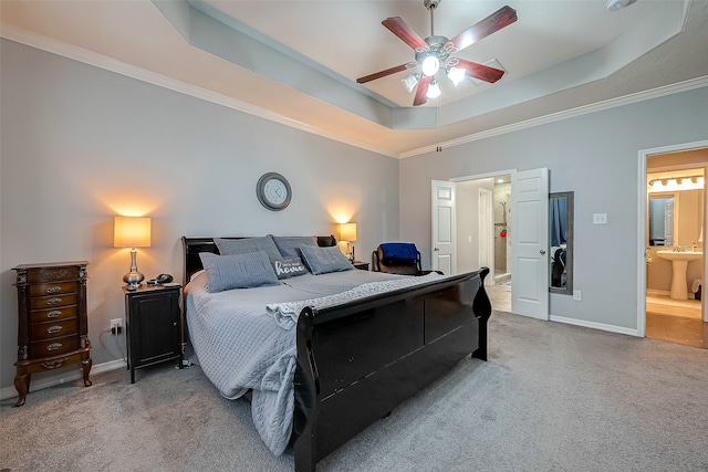 carpeted bedroom featuring crown molding, a raised ceiling, and ceiling fan