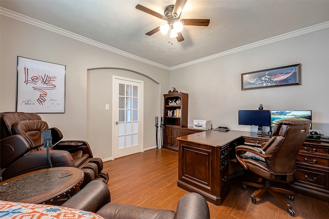 office featuring ornamental molding, light hardwood / wood-style floors, and ceiling fan