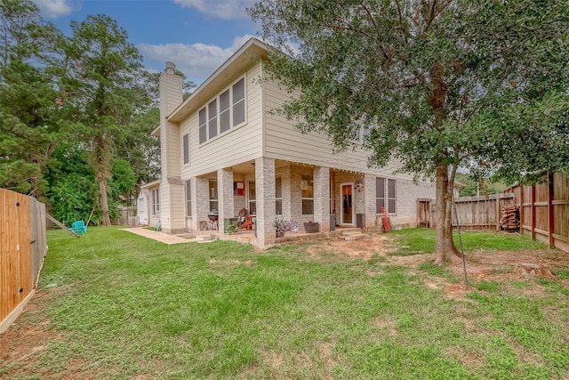 exterior space with a patio and a lawn