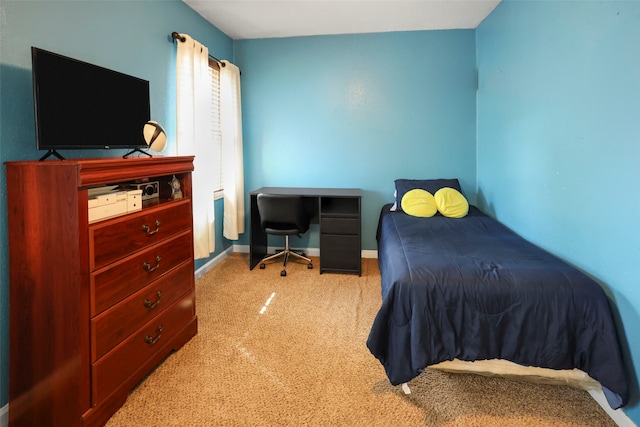 bedroom featuring light colored carpet