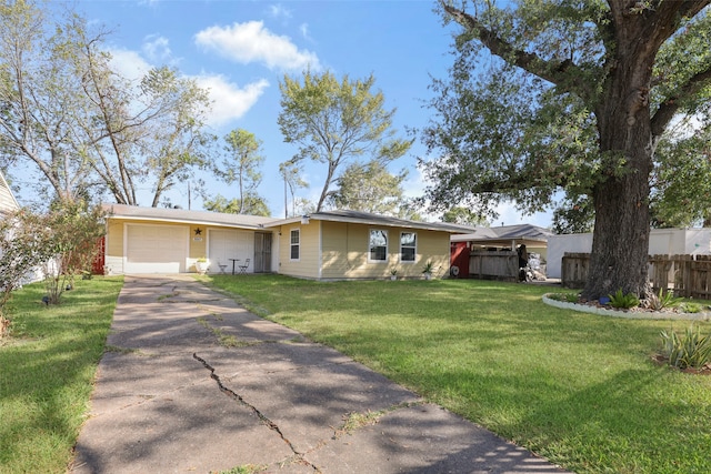 single story home with a front yard and a garage