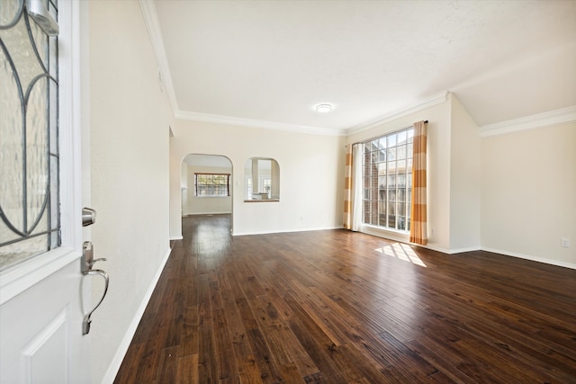 entryway with crown molding and dark hardwood / wood-style flooring