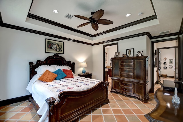 bedroom with ornamental molding, a tray ceiling, and ceiling fan