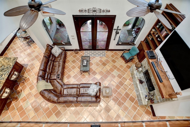 living room with french doors and ceiling fan