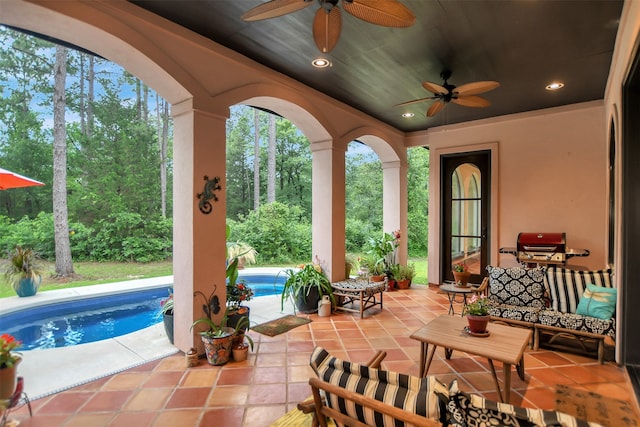 view of patio featuring ceiling fan