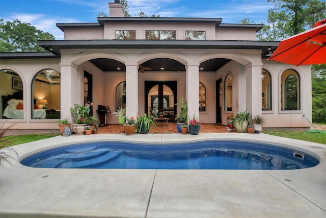 back of house with a patio area and french doors