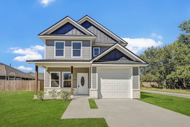 craftsman house featuring a front yard, covered porch, and a garage