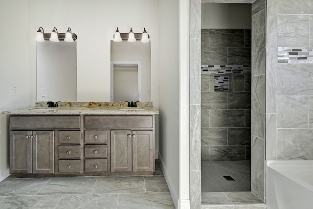 bathroom featuring vanity and tiled shower