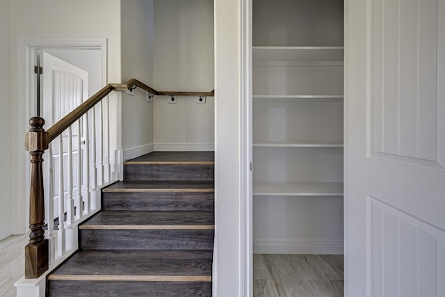 stairway with hardwood / wood-style flooring