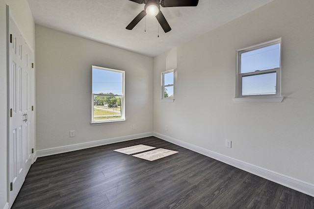 unfurnished bedroom with dark hardwood / wood-style floors and ceiling fan