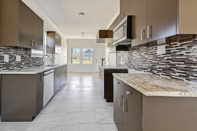 kitchen featuring decorative backsplash, light stone counters, ornamental molding, sink, and stainless steel appliances