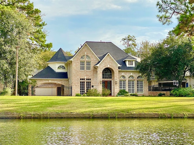 view of front of home featuring a water view and a front yard