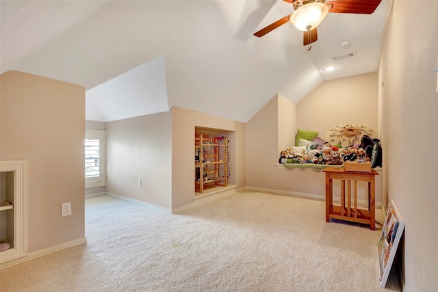 additional living space with ceiling fan, light colored carpet, and lofted ceiling