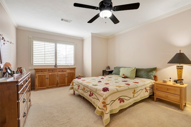 bedroom featuring ceiling fan, crown molding, and light carpet