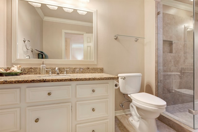 bathroom featuring tiled shower, crown molding, vanity, and toilet