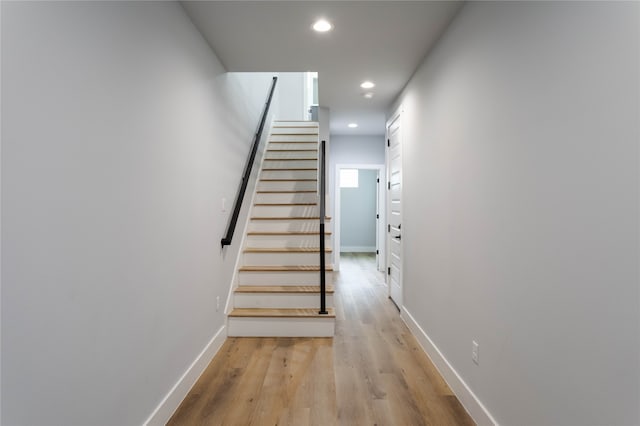 staircase featuring hardwood / wood-style floors