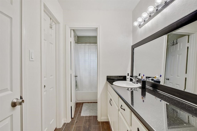 bathroom with vanity and shower / bath combo with shower curtain