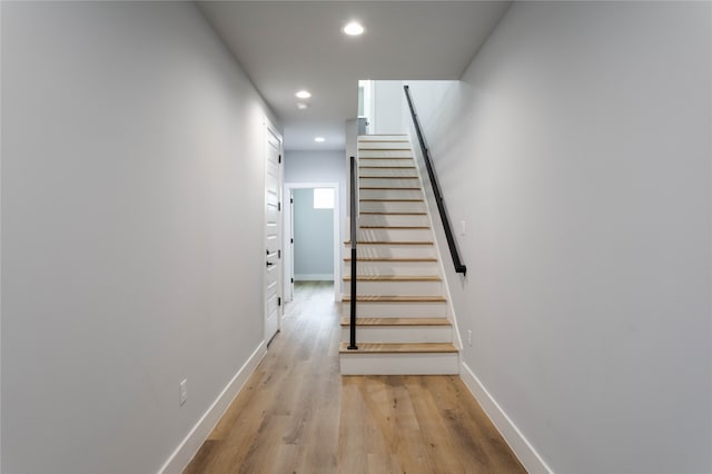 stairway featuring hardwood / wood-style floors