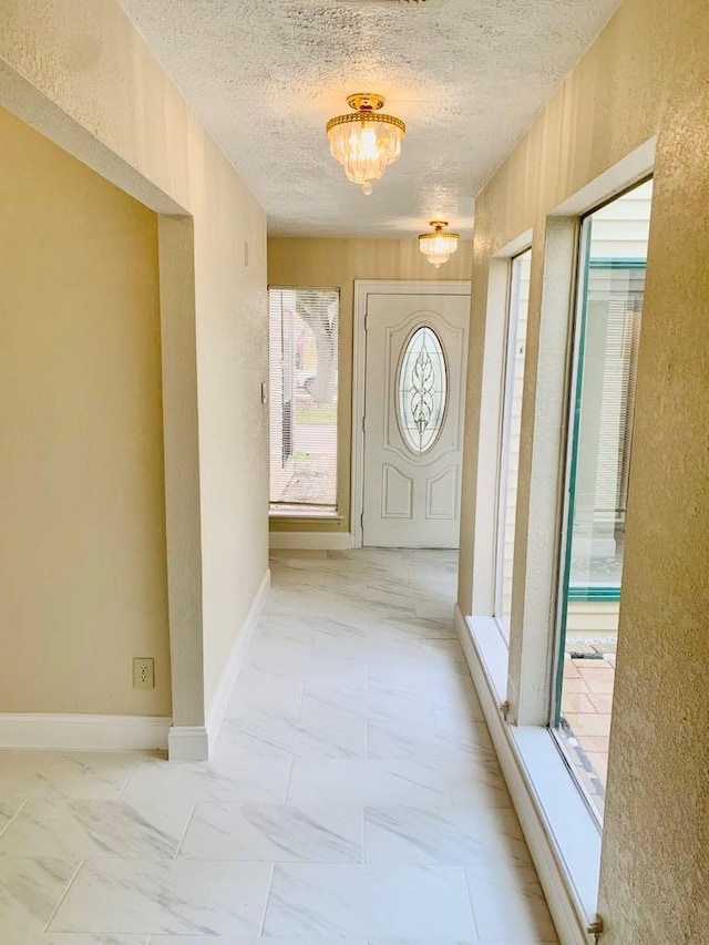 entryway featuring a textured ceiling