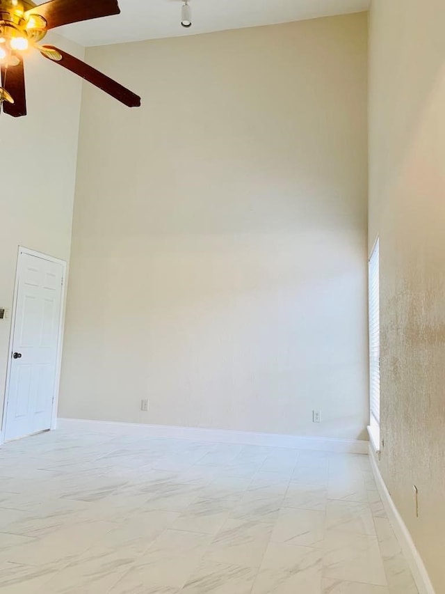 unfurnished room featuring ceiling fan