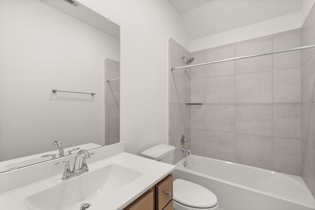 full bathroom featuring vanity, toilet, and tiled shower / bath