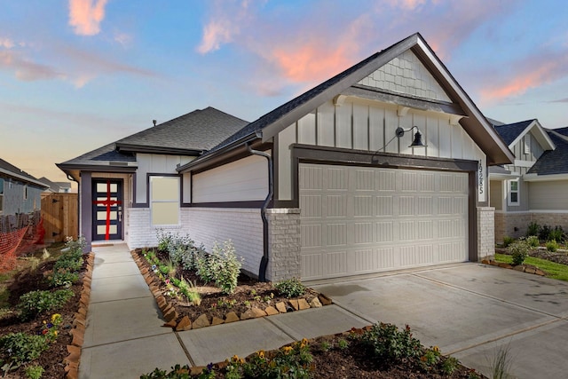 view of front of property with a garage