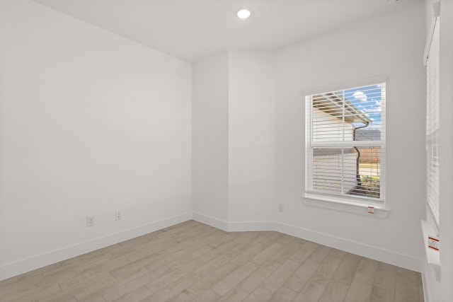 spare room featuring light wood-type flooring