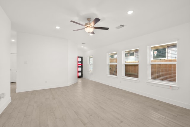 unfurnished room with ceiling fan, plenty of natural light, and light hardwood / wood-style floors