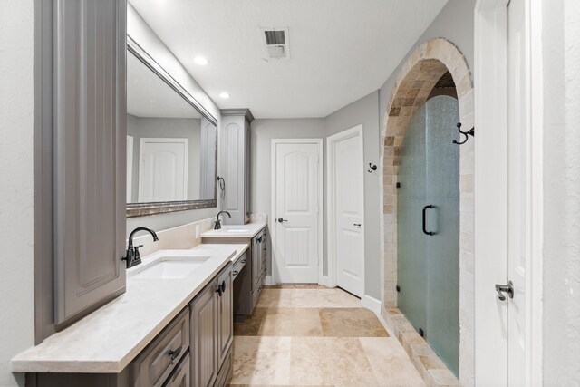 bathroom with vanity and an enclosed shower