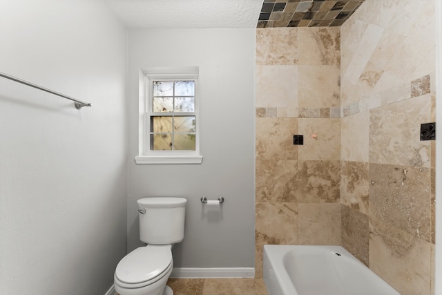 bathroom with tile patterned flooring, toilet, and a textured ceiling