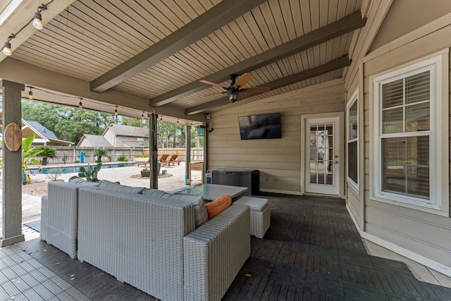 wooden deck with ceiling fan and a fenced in pool