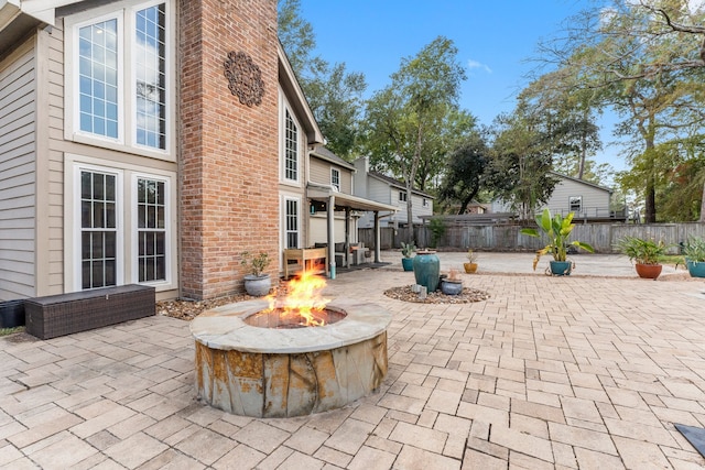 view of patio with an outdoor fire pit