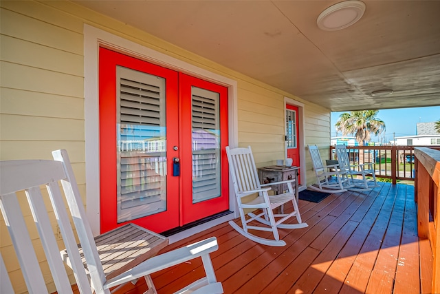 wooden deck featuring french doors