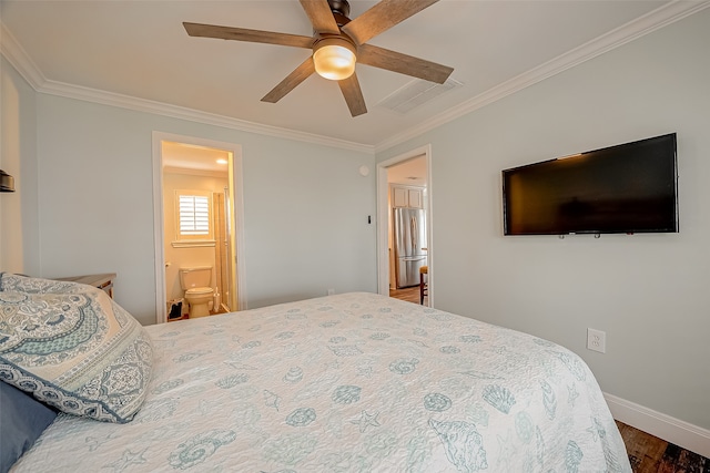 bedroom with ceiling fan, connected bathroom, stainless steel refrigerator, ornamental molding, and dark wood-type flooring