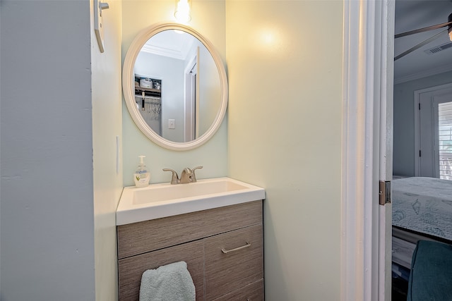 bathroom with vanity and crown molding