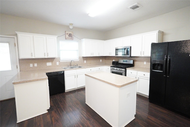 kitchen featuring black appliances, sink, a kitchen island, dark hardwood / wood-style flooring, and white cabinetry