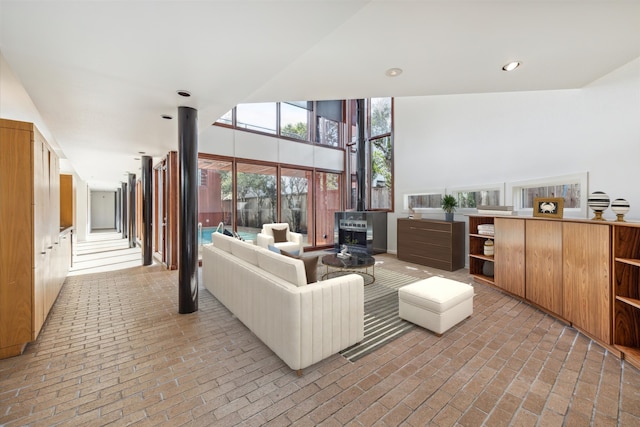 living room featuring a high ceiling