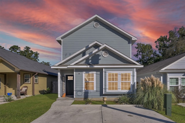 view of front of property with a lawn