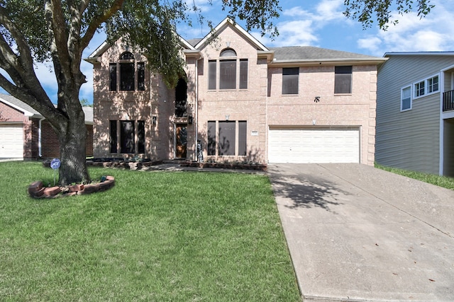 view of front of house featuring a front lawn and a garage