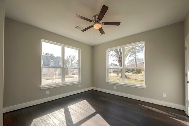 unfurnished room featuring dark hardwood / wood-style floors and ceiling fan