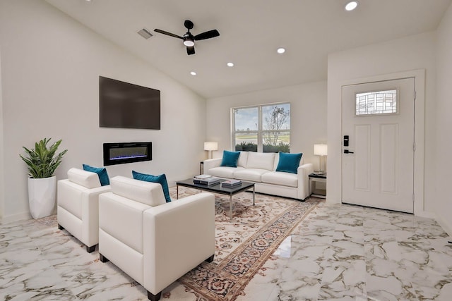 living room with ceiling fan and vaulted ceiling