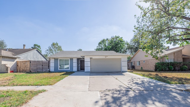 ranch-style home with a front yard and a garage