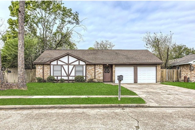 view of front of house with a garage and a front lawn