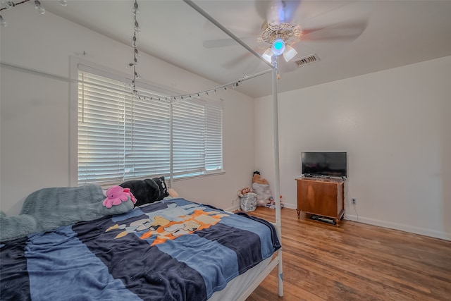 bedroom featuring ceiling fan and wood-type flooring