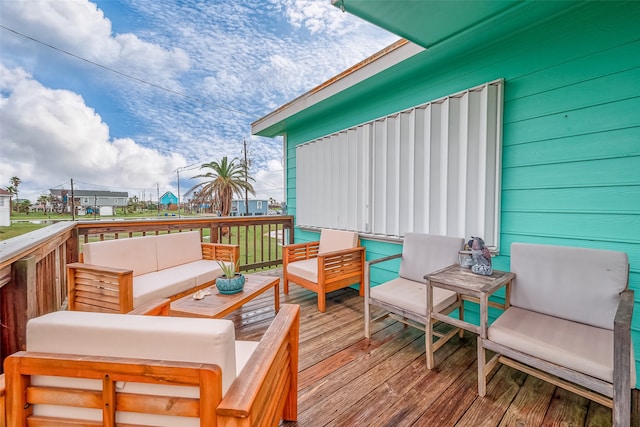 wooden deck with an outdoor hangout area