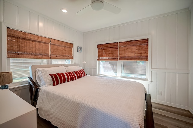 bedroom featuring dark hardwood / wood-style flooring and ceiling fan