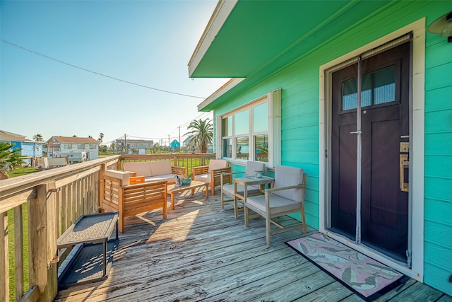 wooden deck with outdoor lounge area